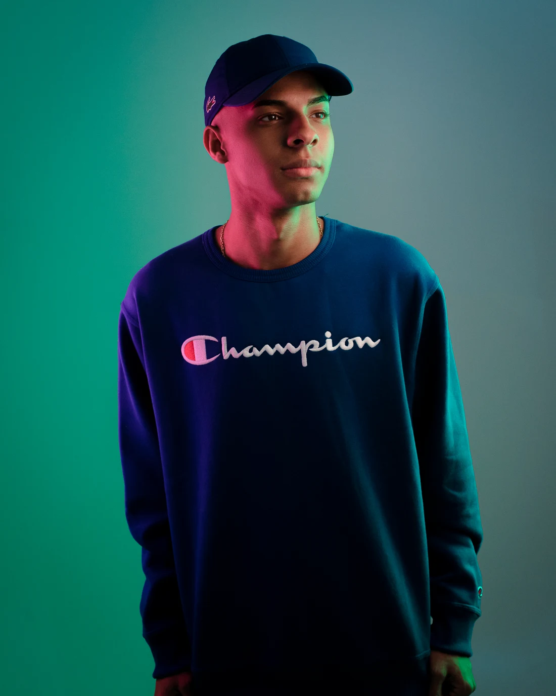 Portrait of DJ Felipe Único with cyan and magenta lighting